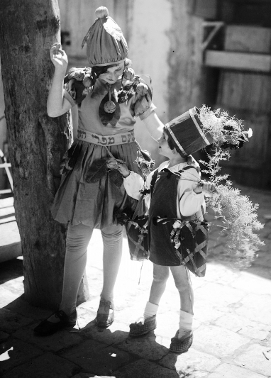 A boy and a girl dressed as a sapling and as fruits of Palestine, Jerusalem, 1930.