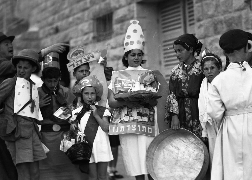  Children with costumes about locally made products, Jerusalem, 1937.